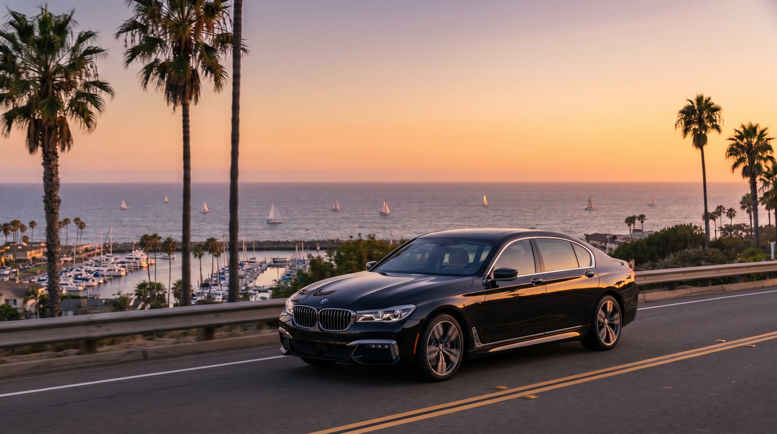 Black sedan on Pacific Coast Highway near Newport harbor